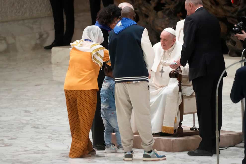 Pope Francis meets refugee families in the Paul VI hall at the Vatican, Saturday, March 18, 2023 (Gregorio Borgia/AP/PA)