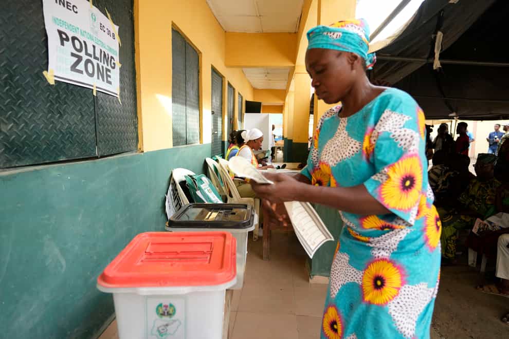 A woman casts her vote in Lagos (Sunday Alamba/AP)
