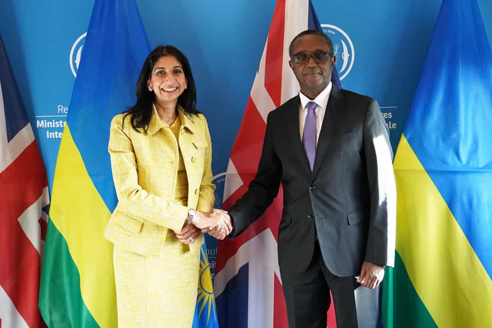 Home Secretary Suella Braverman shakes hands with Rwandan minister for foreign affairs and international co-operation, Vincent Biruta in Kigali, during her visit to Rwanda. Picture date: Saturday March 18, 2023.