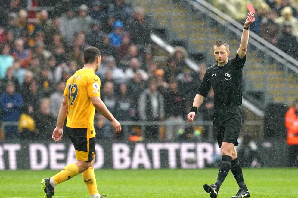 Wolverhampton Wanderers’ Jonny (left) is shown a red card (Nick Potts/PA)