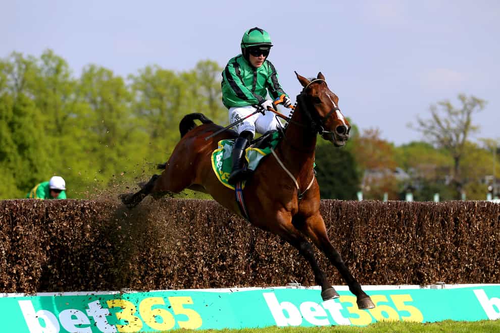 Hewick ridden by jockey Jordan Gainford clears a jump on their way to winning the bet365 Gold Cup Handicap Chase during the bet365 Jump Finale Day at Sandown Park Racecourse, Esher. Picture date: Saturday April 23, 2022. (Nigel French/PA)