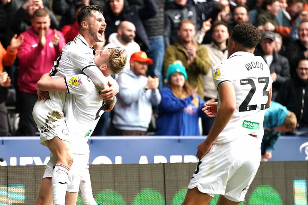 Swansea’s Liam Cullen (left) celebrates scoring his side’s first goal in their 2-0 victory over Bristol City (Nick Potts/PA)