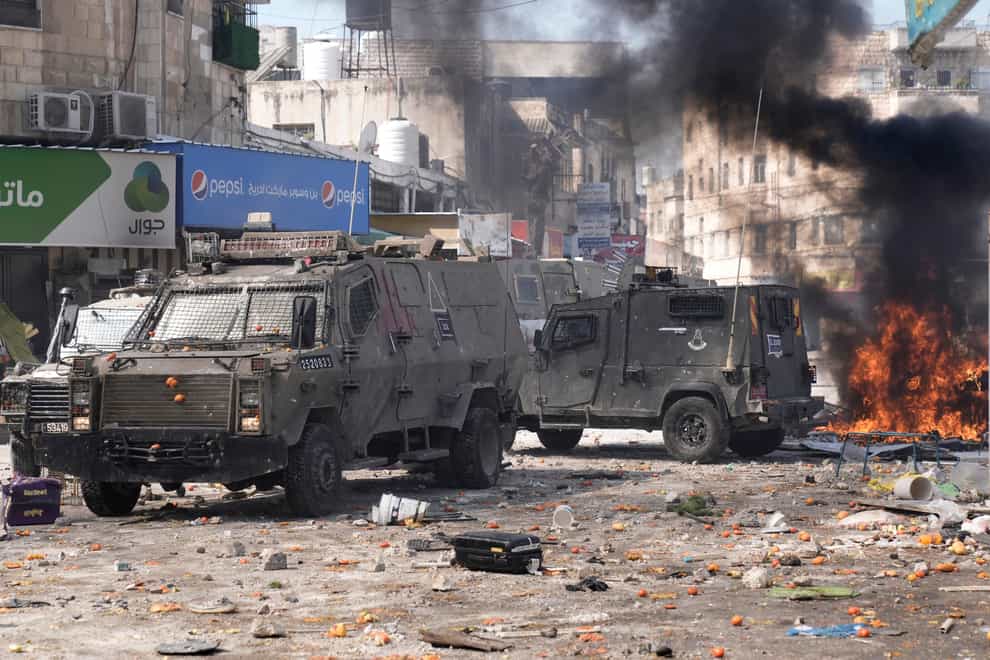Palestinians clash with Israeli forces in the West Bank city of Nablus (AP Photo/Majdi Mohammed)