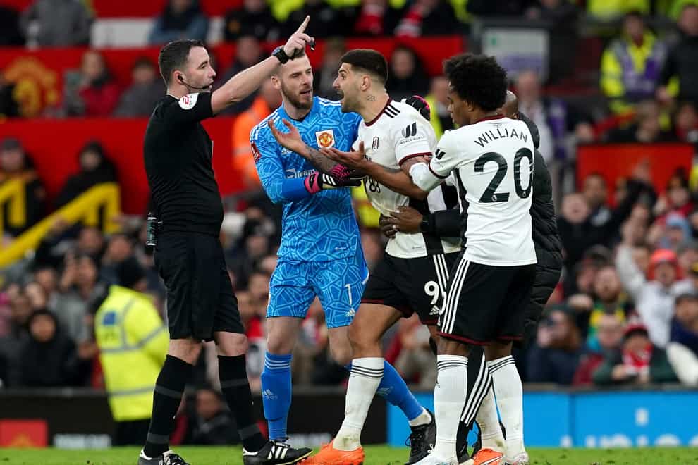 Fulham’s Aleksandar Mitrovic (centre) is sent off by referee Chris Kavanagh during the Emirates FA Cup quarter-final match at Old Trafford, Manchester. Picture date: Sunday March 19, 2023.