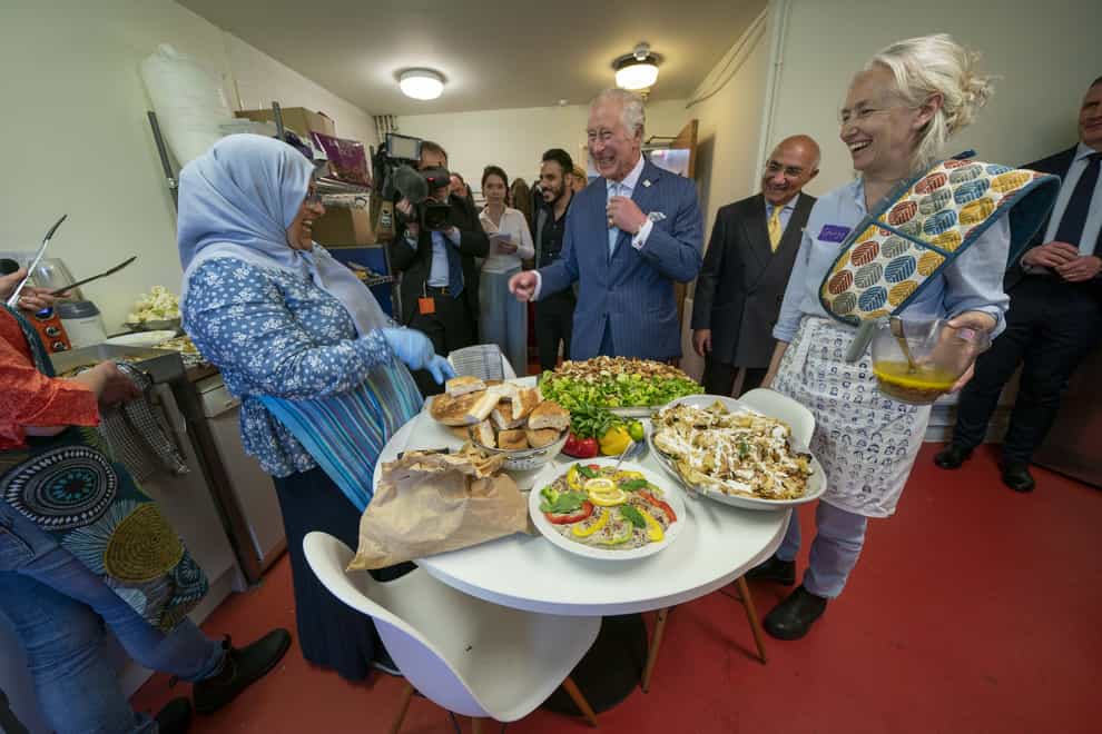 Charles with beneficiaries, staff and volunteers at the West London Welcome community centre (Arthur Edwards/The Sun/PA)