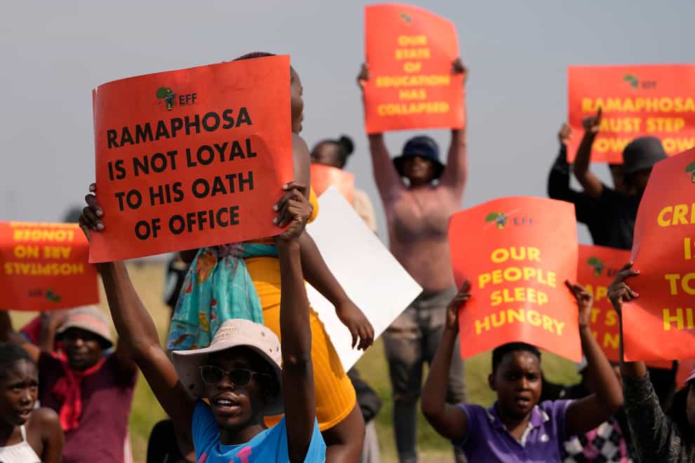 Economic Freedom Fighters members protest in Tsakane township, east of Johannesburg, calling for South African President Cyril Ramaphosa to resign (Themba Hadebe/AP)
