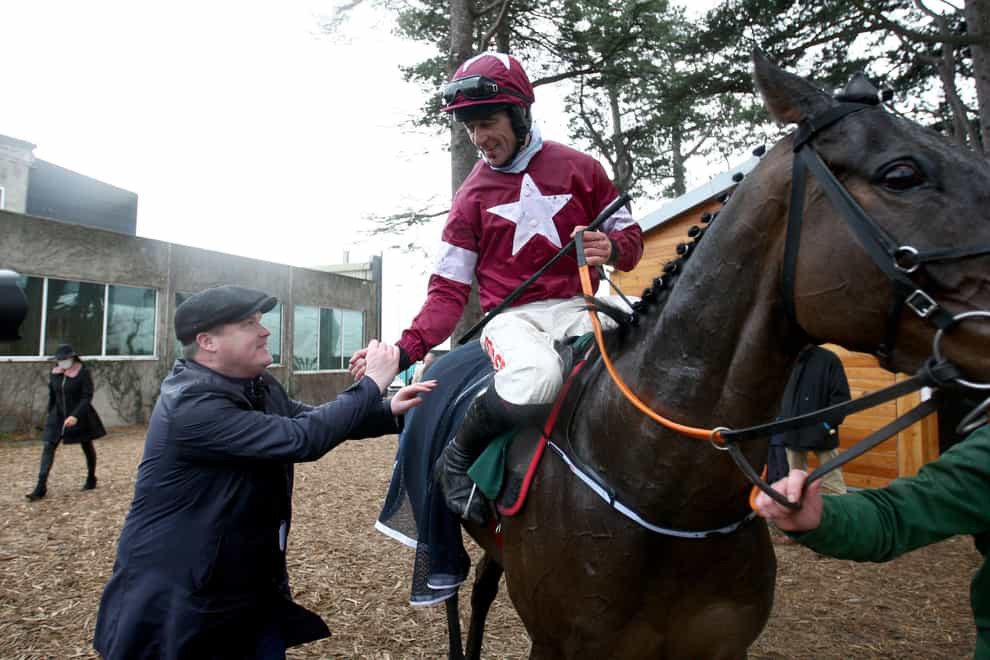 Trainer Gordon Elliott with Davy Russell and Conflated after winning the Irish Gold Cup during day one of the Dublin Racing Festival at Leopardstown Racecourse in Dublin, Ireland. Picture date: Saturday February 5, 2022.