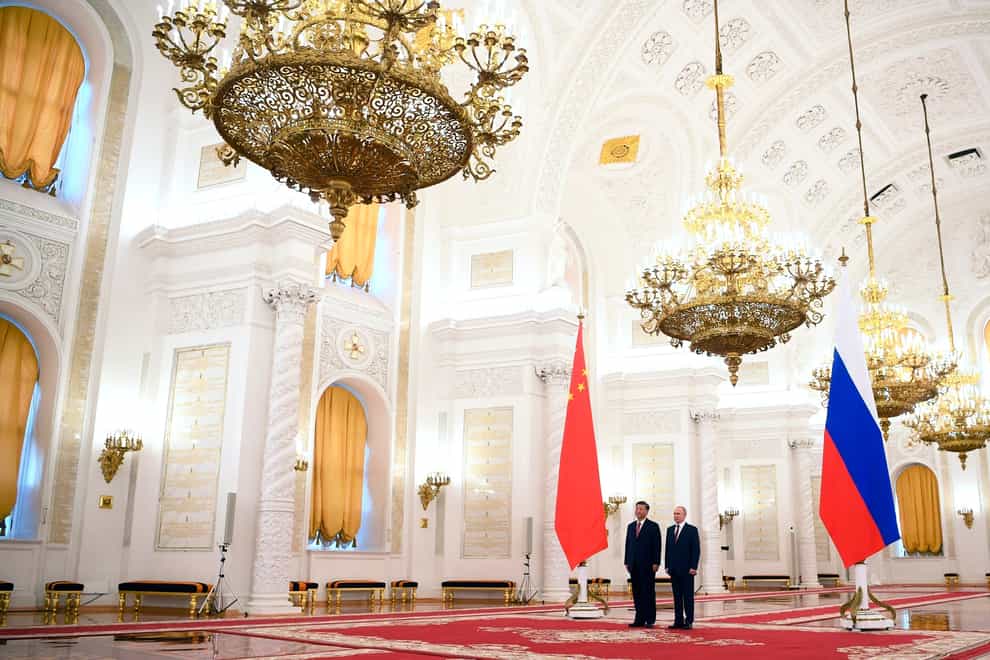 Russian President Vladimir Putin, right, and Chinese President Xi Jinping at The Grand Kremlin Palace (Alexey Maishev, Sputnik, Kremlin Pool/AP)