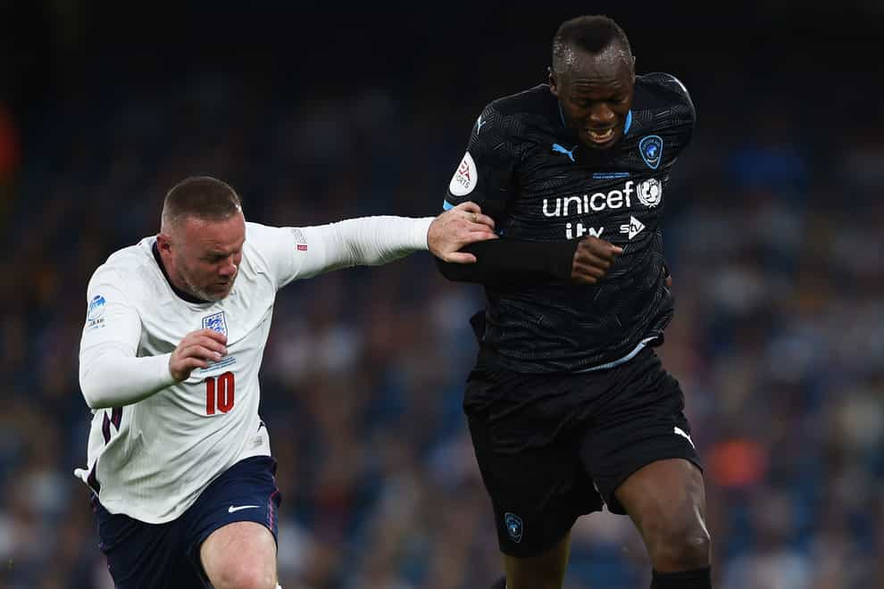 Usain Bolt (right) and Wayne Rooney challenged during a previous Soccer Aid for UNICEF match (Soccer Aid handout/PA)