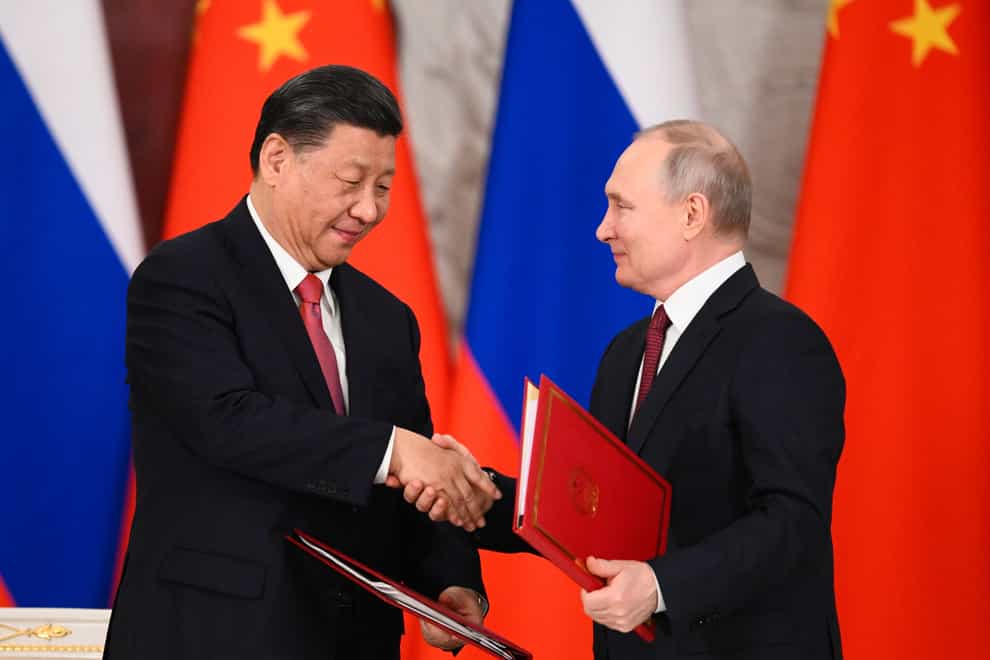 Russian President Vladimir Putin and Chinese President Xi Jinping following talks in Moscow (Vladimir Astapkovich/Sputnik/AP)