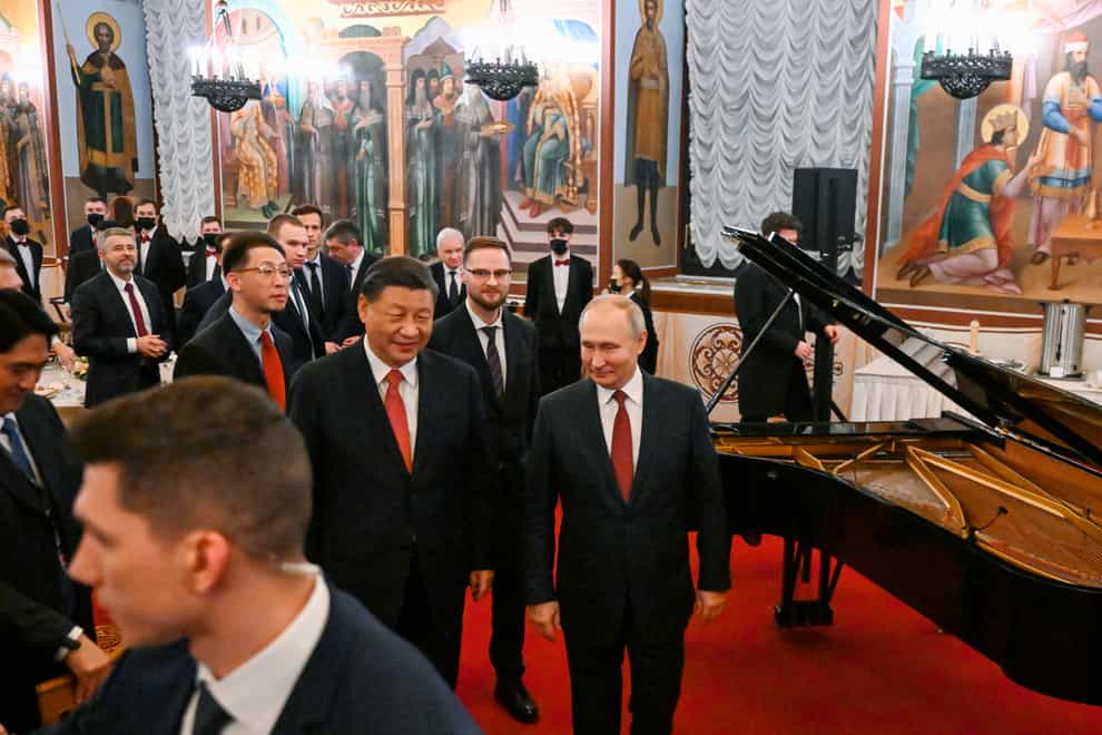 Chinese president Xi Jinping, centre left, and Russian president Vladimir Putin, right, at the Kremlin in Moscow (Grigory Sysoyev, Sputnik, Kremlin Pool Photo via AP)