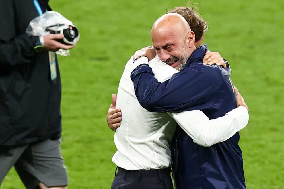 Italy manager Roberto Mancini (left) and Gianluca Vialli embrace on the pitch following their Euro 2024 win over England. (Christian Charisius/PA Media)