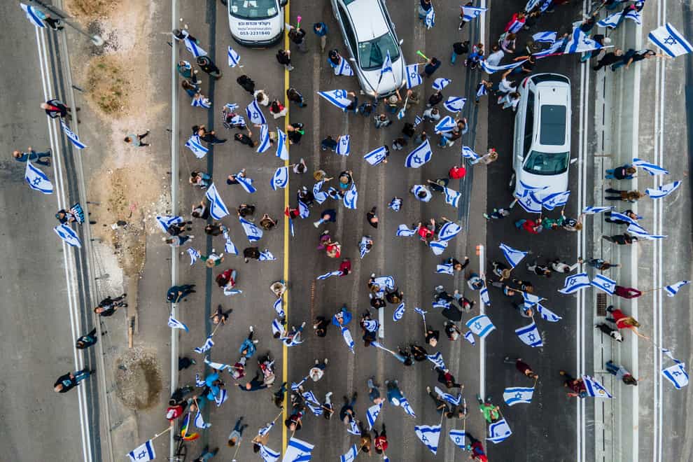 Israelis protest against plans by Prime Minister Benjamin Netanyahu’s government to overhaul the judicial system (Ariel Schalit/AP)