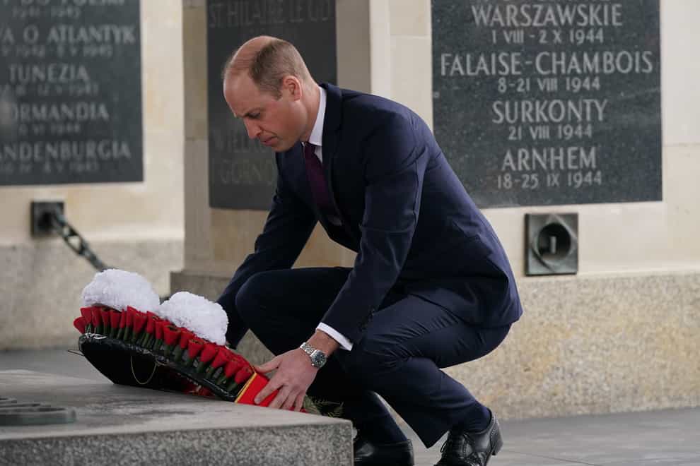 The Prince of Wales lays a wreath at the Tomb of the Unknown Soldier, a monument dedicated to Polish soldiers who lost their lives in conflict (Yui Mok/PA)