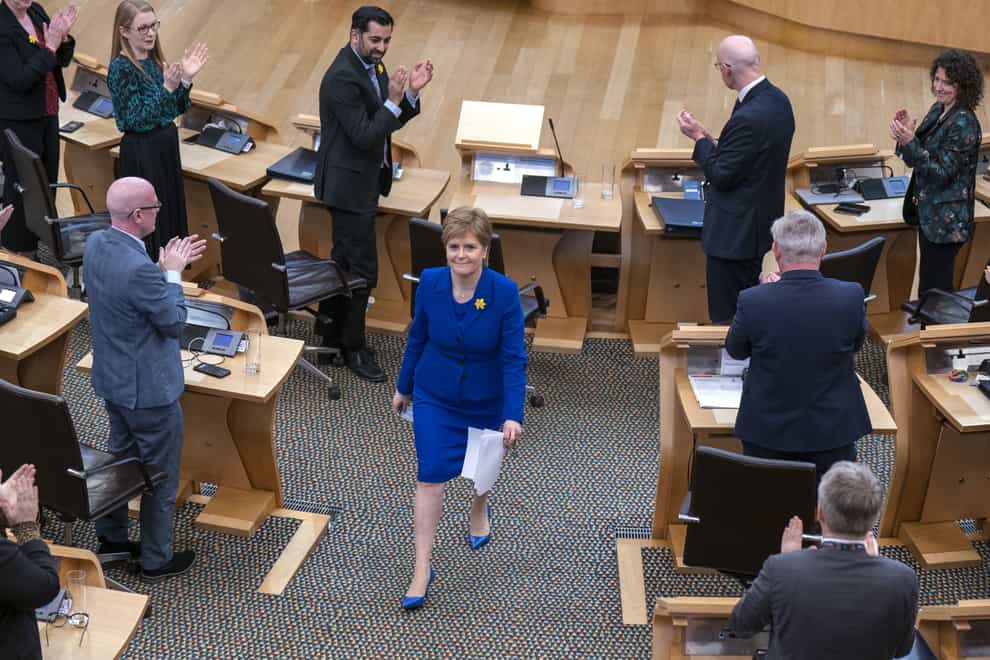 First Minister Nicola Sturgeon leaves the main chamber at Holyrood after her final First Minster’s Questions (Jane Barlow/PA)