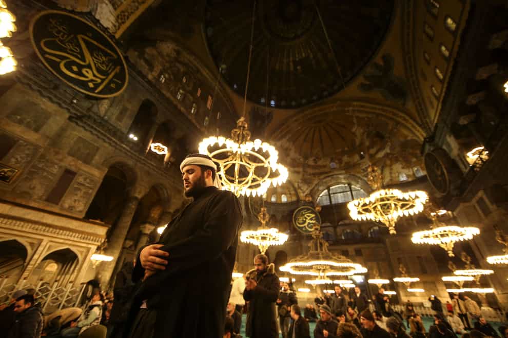 Muslim worshippers perform a night prayer called tarawih during the eve of the first day of the Muslim holy fasting month of Ramadan at Hagia Sophia mosque in Istanbul, Turkey (Emrah Gurel/AP)