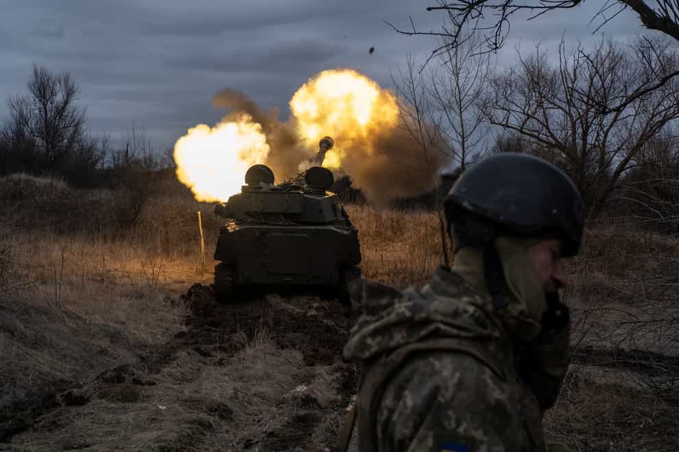 A Ukrainian artillery vehicle fires on the front line (AP)