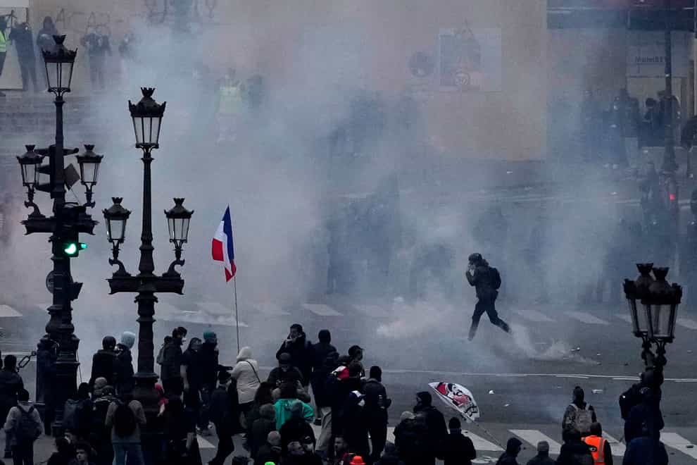 Protesters scuffle at the end of a rally in Paris on Thursday (Christophe Ena/AP)