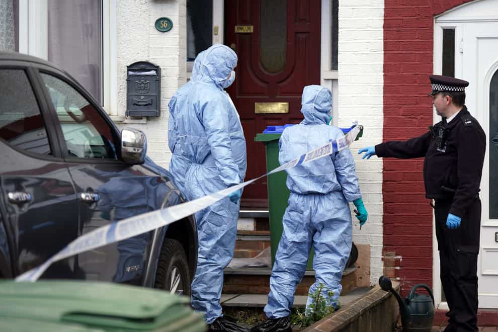 Police forensics officers attend the scene where the bodies were found in Belvedere (Yui Mok/PA)