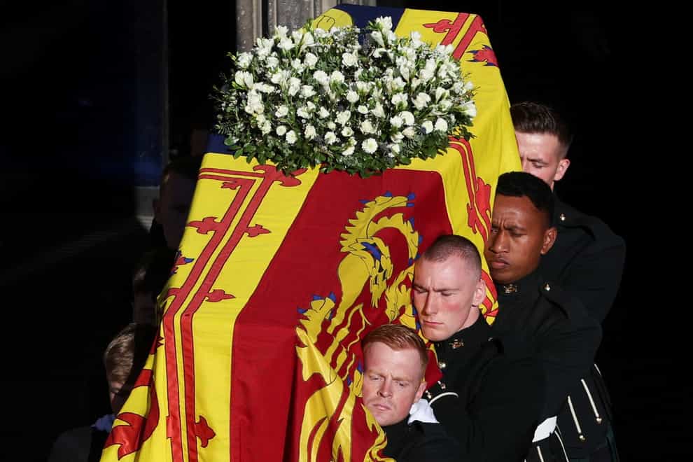 Pallbearers carry the coffin of Queen Elizabeth II as it departs St Giles’ Cathedral (Russell Cheyne/PA)
