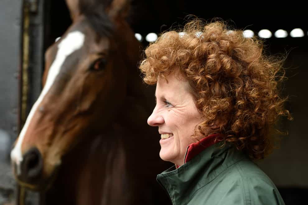 Grand National winner One For Arthur pictured with trainer Lucinda Russell at her yard in Kinross, Scotland. (Ian Rutherford/PA)