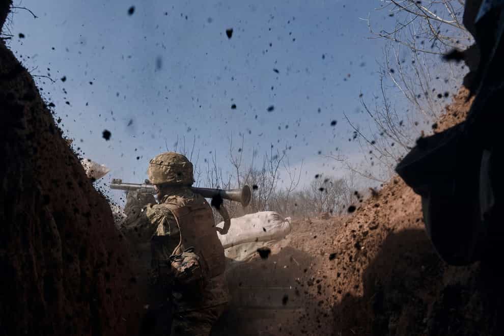 A Ukrainian soldier on the frontline during a battle with Russian troops near Bakhmut, Donetsk region (Libkos/AP)