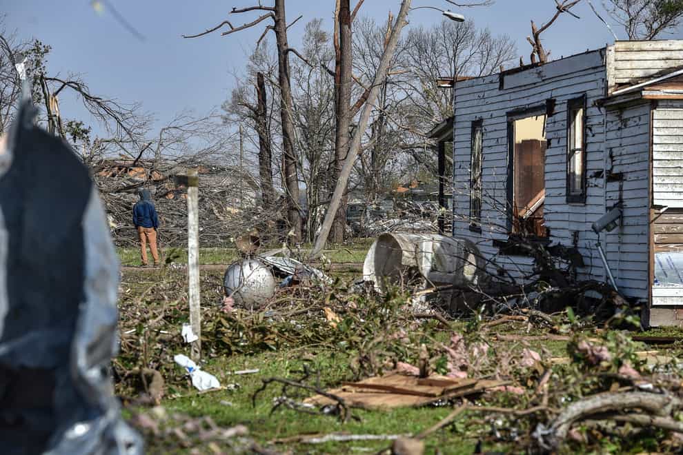 Search and recovery crews resumed the daunting task of digging through the debris of flattened and battered buildings on Sunday after at least 25 people were killed, dozens of others injured and hundreds displaced by a deadly tornado that ripped through the Mississippi Delta (The Clarion-Ledger/AP)