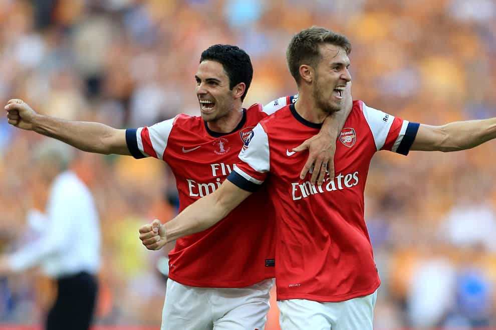 Aaron Ramsey (right) and Mikel Arteta celebrate Arsenal winning the FA Cup in 2014 (Nick Potts/PA)