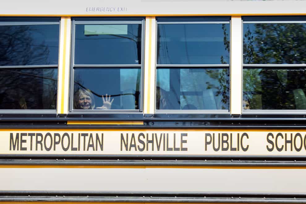 A child weeps on the bus leaving The Covenant School after the mass shooting (Nicole Hester/The Tennessean/AP)