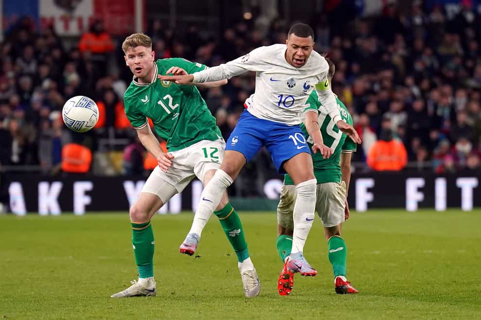 Republic of Ireland’s Nathan Collins, left, and France’s Kylian Mbappe (Niall Carson/PA)