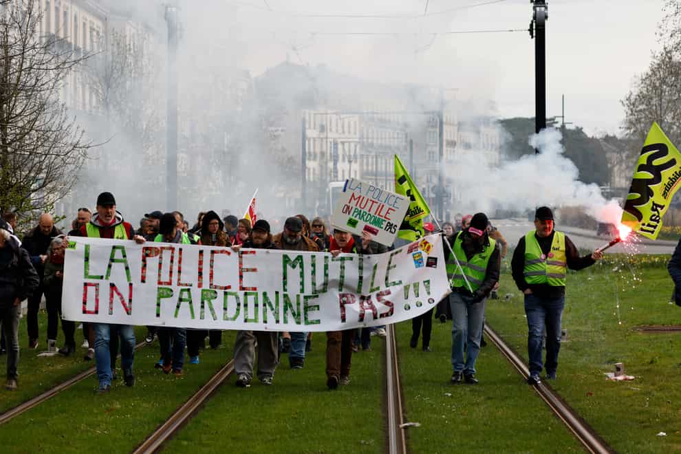Demonstrators march in Nantes, western France (Jeremias Gonzalez/AP)