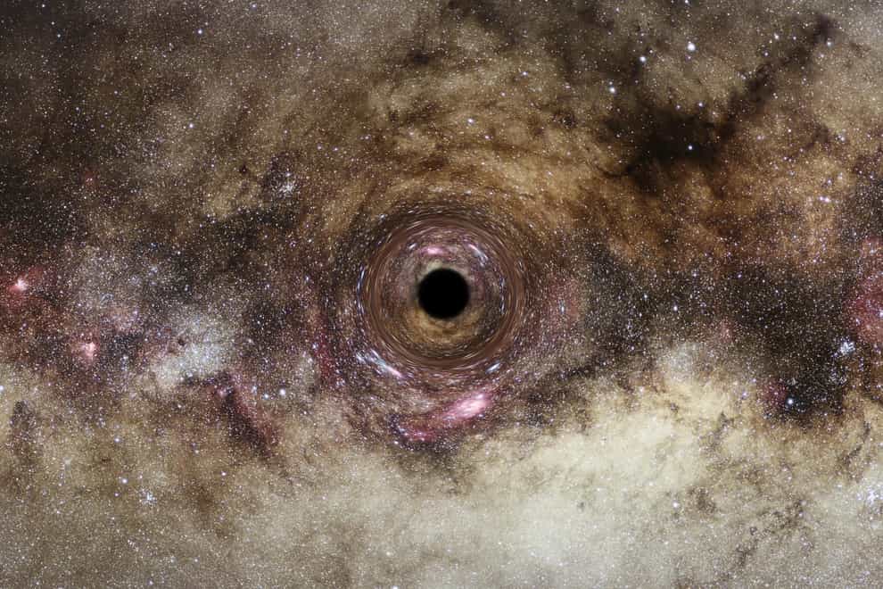 An artist’s impression of a black hole, where the black hole’s intense gravitational field distorts the space around it (ESA/Hubble, Digitized Sky Survey/Nick Risinger/N Bartmann/Durham University)