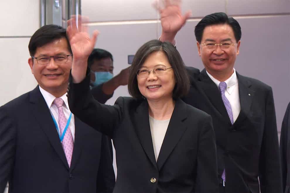 Taiwan president Tsai Ing-wen, centre, left on Wednesday to begin her 10-day tour of the Americas (Johnson Lai/AP)