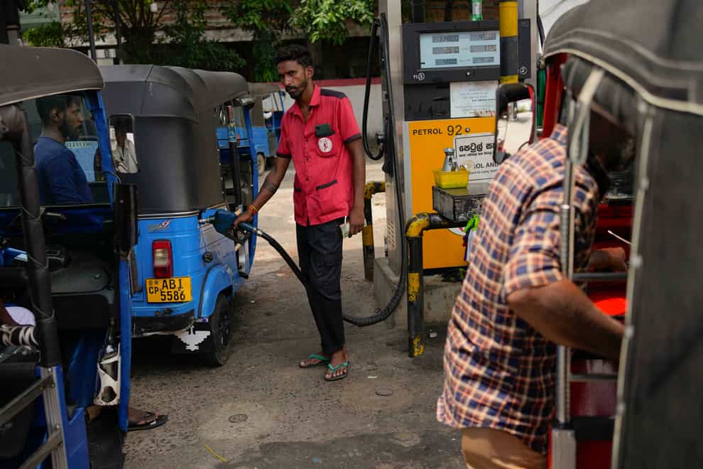 People rushed to petrol stations fearing supply would run out (Eranga Jayawardena/AP)