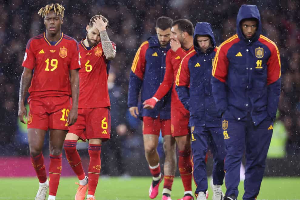 Spain players walk off dejected following their defeat at Hampden (Steve Welsh/PA)
