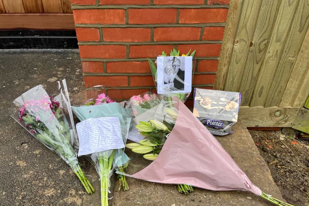 Flowers and messages left at the Kent home of TV presenter and comedian Paul O’Grady (Harry Stedman/PA)