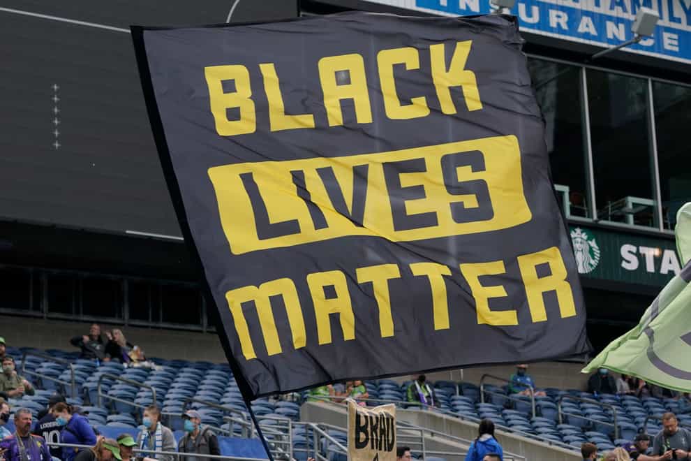 Adidas said it planned to withdraw its objection to a Black Lives Matter bid to trademark a three-stripe logo (AP Photo/Ted S. Warren, File)
