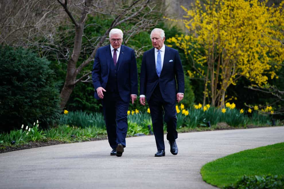 The King and German President Frank-Walter Steinmeier after planting a tree after attending a Green Energy reception at Bellevue Palace, Berlin, the official residence of the President of Germany (Ben Birchall/PA)