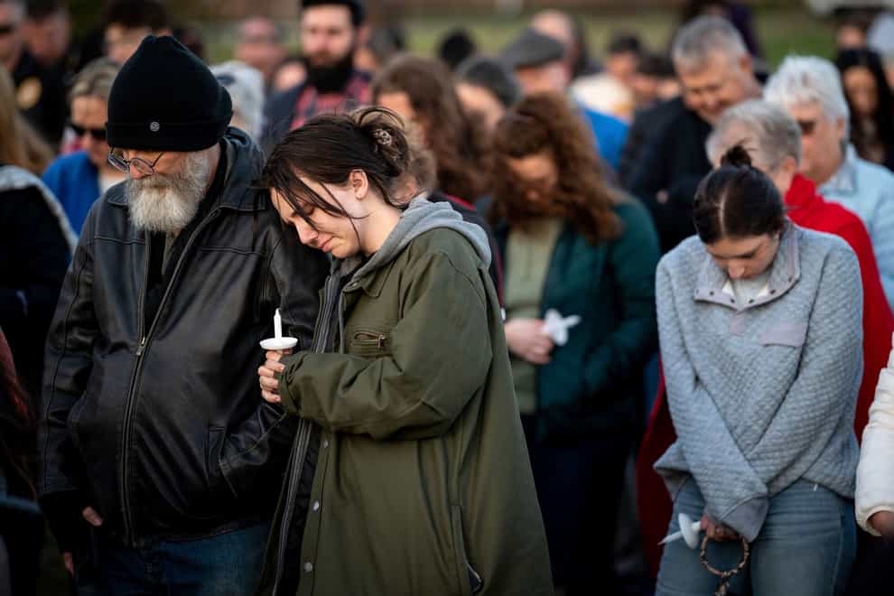 People pray during a community vigil held for the people killed during the Covenant School shooting (Andrew Nelles/The Tennessean via AP)