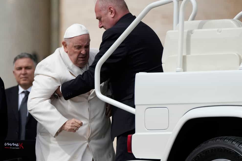 Pope Francis is helped into his car at the end of the weekly general audience in St. Peter’s Square, at the Vatican, Wednesday, March 29, 2023. Pope Francis went to a Rome hospital on Wednesday for some previously scheduled tests, slipping out of the Vatican after his general audience and before the busy start of Holy Week this Sunday. (AP Photo/Alessandra Tarantino)