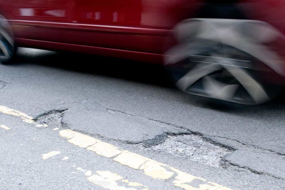 The government will fine utility firms for poor road repairs. (PA)
