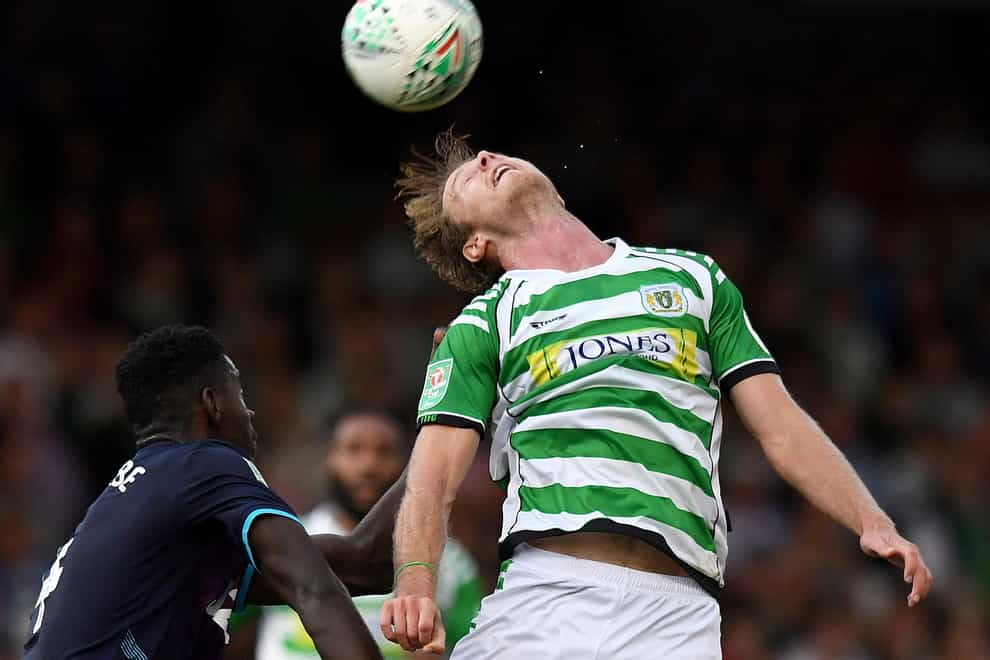 Yeovil’s Alex Fisher was carried off on a stretcher after lengthy treatment (Simon Galloway/PA)