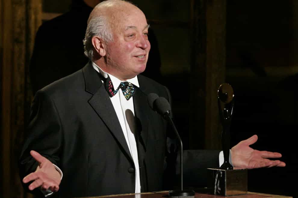 Seymour Stein accepts his award during the Rock and Roll Hall of Fame induction ceremony in March 2005 (AP)