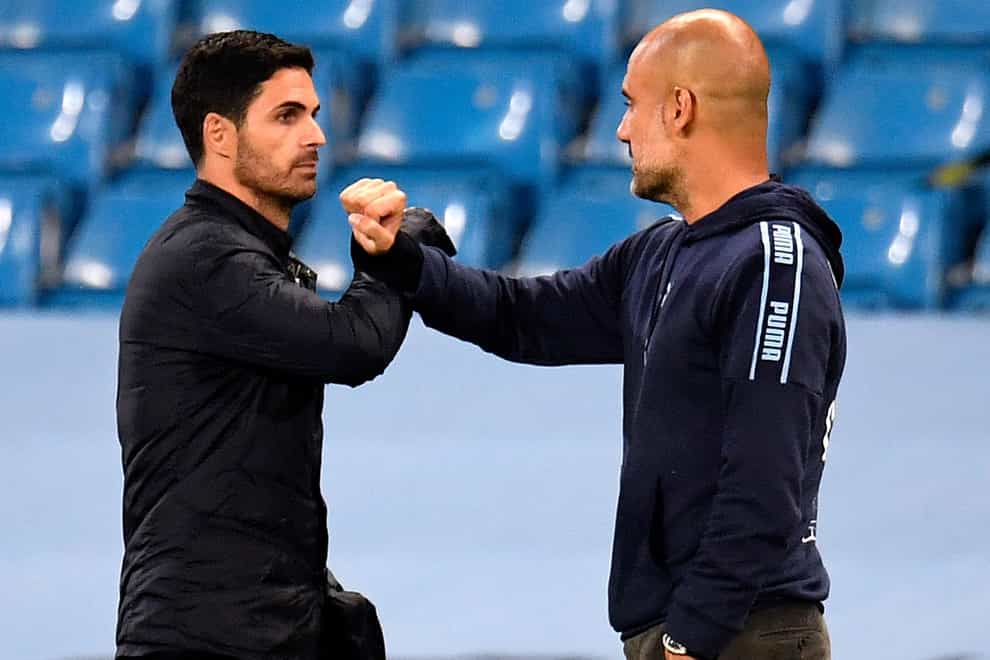 Arsenal manager Mikel Arteta (left) and Manchester City manager Pep Guardiola are going head-to-head in the title race (Peter Powell/NMC Pool)