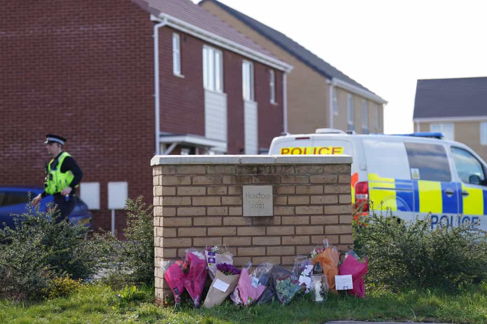 Flowers left at the scene in Meridian Close, Bluntisham, Cambridgeshire, where police found the body of Joshua Dunmore, 32, with a gunshot wound (Joe Giddens/PA)