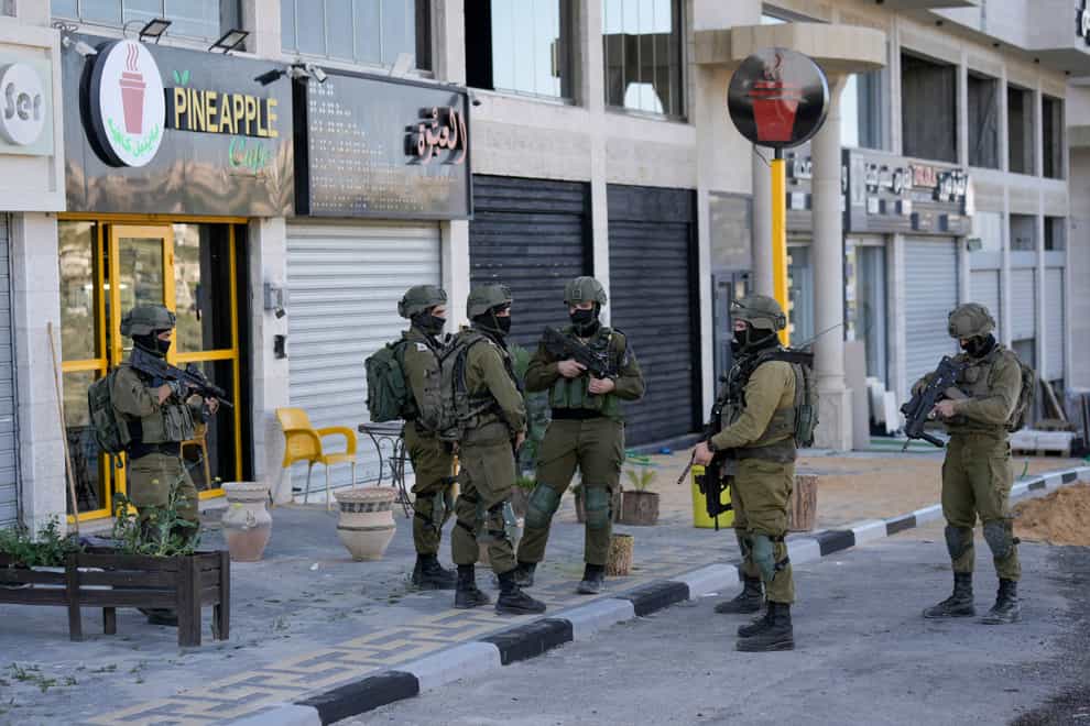 File photo of Israeli security forces in the West Bank (Majdi Mohammed/AP)
