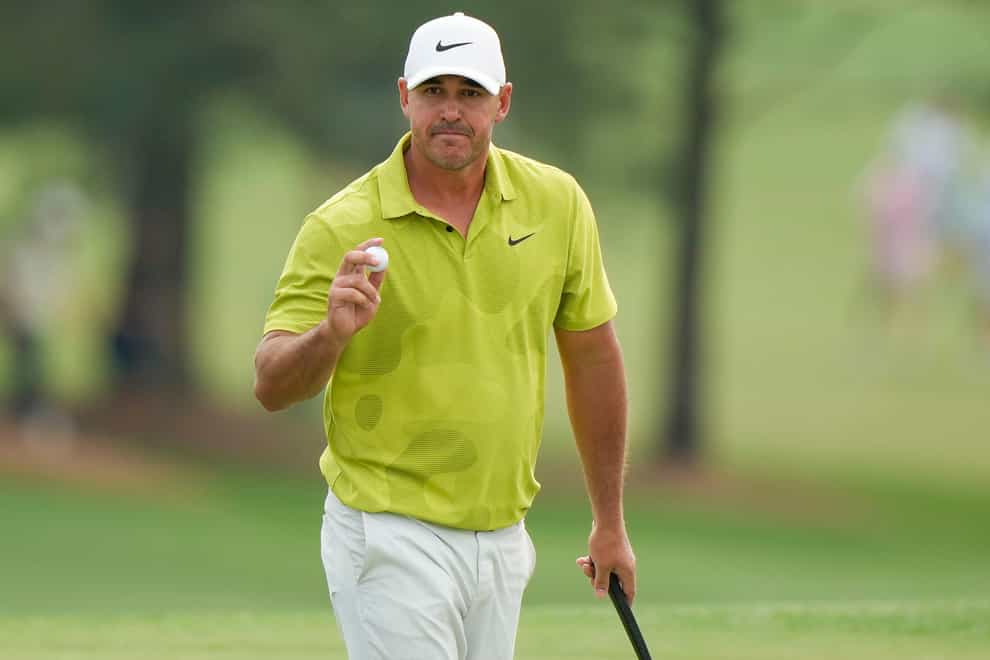 Brooks Koepka was cleared of a potential rules breach in his opening 65 in the Masters (Charlie Riedel/AP)
