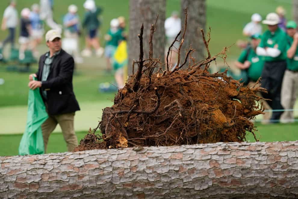 Authorities investigate the scene where trees fell on the 17th hole during the second round of the Masters (Mark Baker/AP)