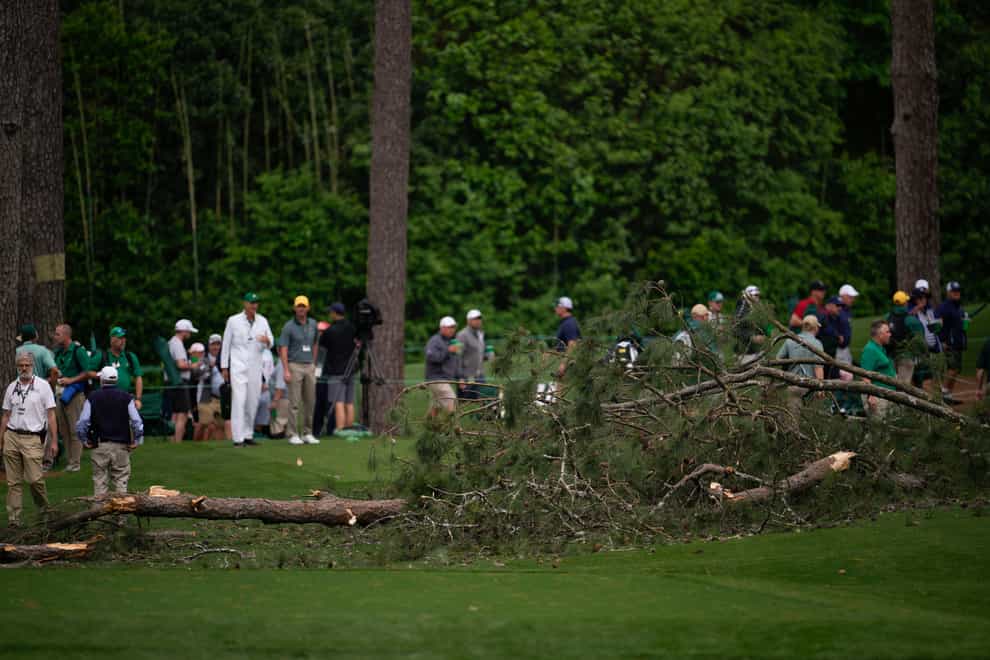 Authorities investigate the scene where trees fell on the 17th hole during the second round of the Masters (Matt Slocum/AP)