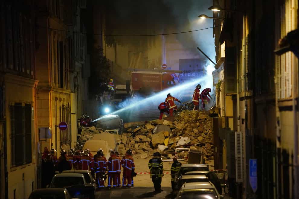 Firefighters work after a building collapsed in Marseille, southern France (AP)